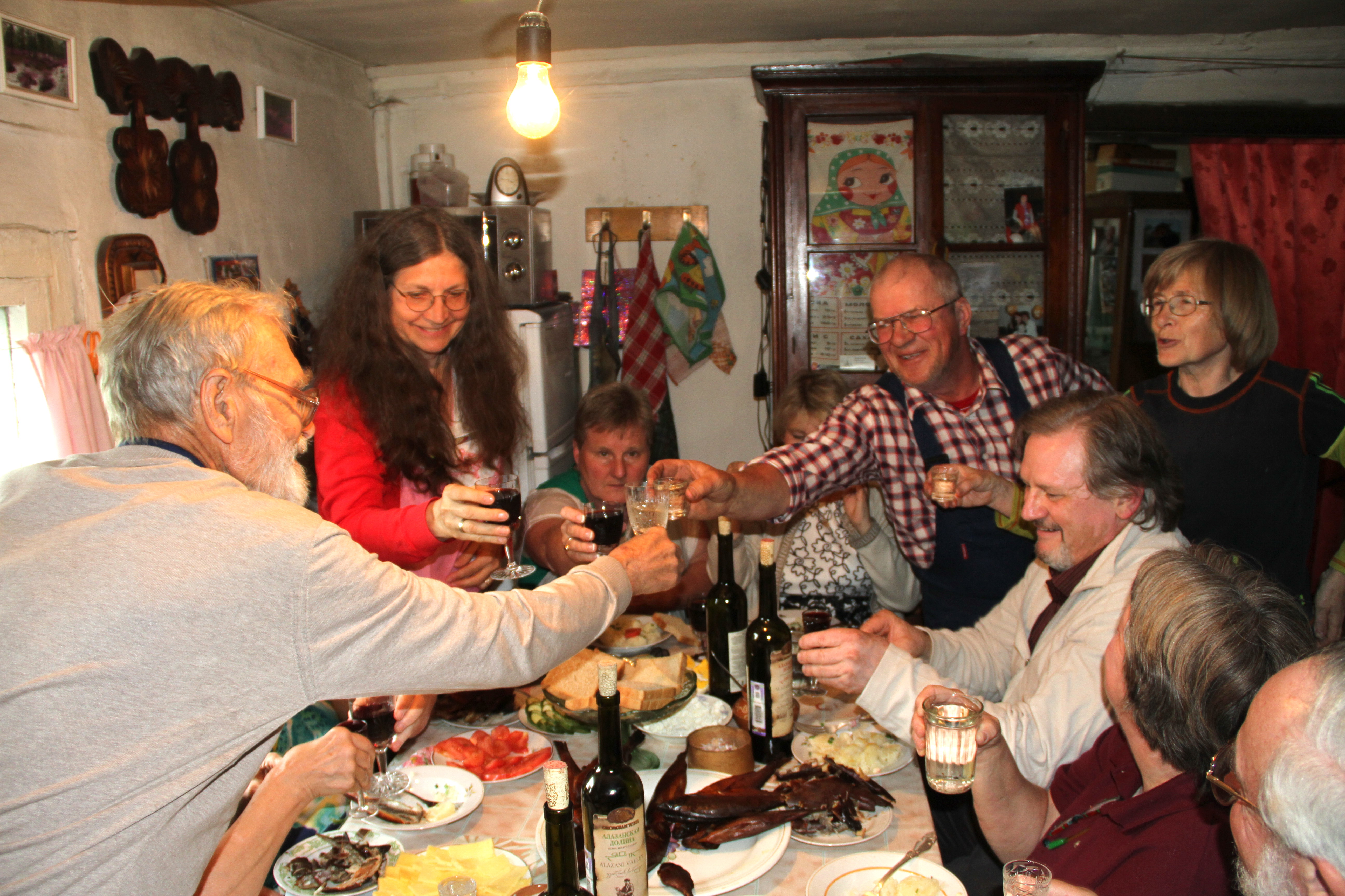 Group toasting at dinner table