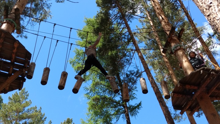 two girls on high rope walkways