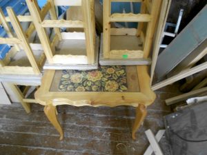 a table and chairs in Russian folk style made by children at the Center