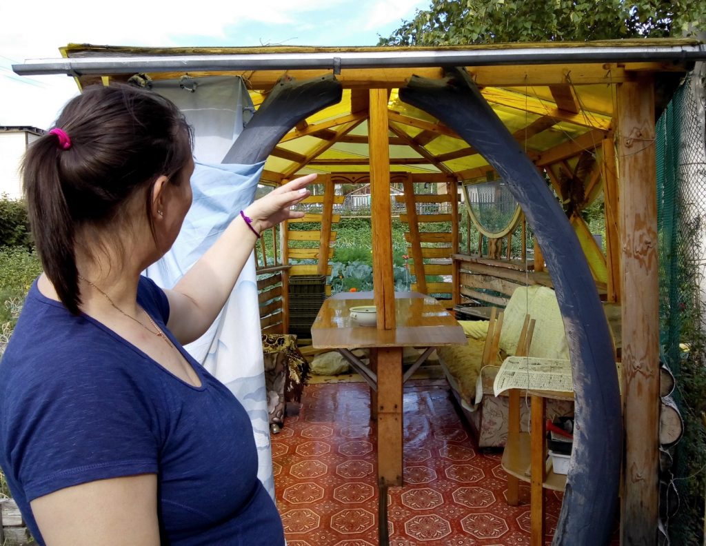 woman pointing out that some wood pieces resemble the Loch Ness monster