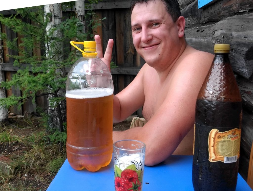 man cooling off outside during a Russian banya