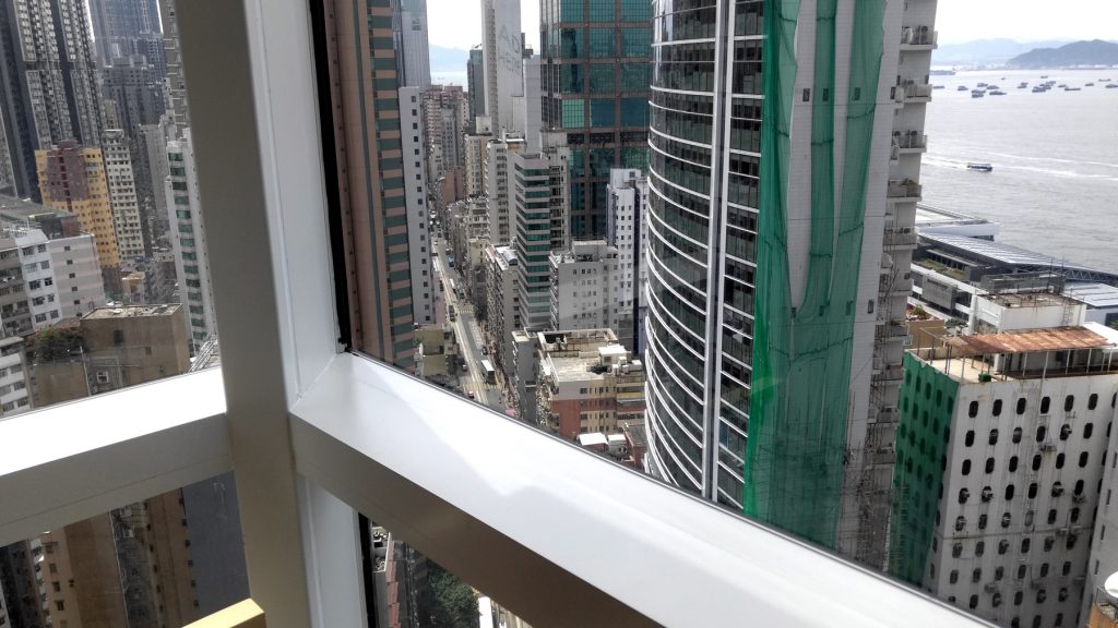 view from 25th floor looking at Hong Kong and Causeway Bay, boats, ships, highrises