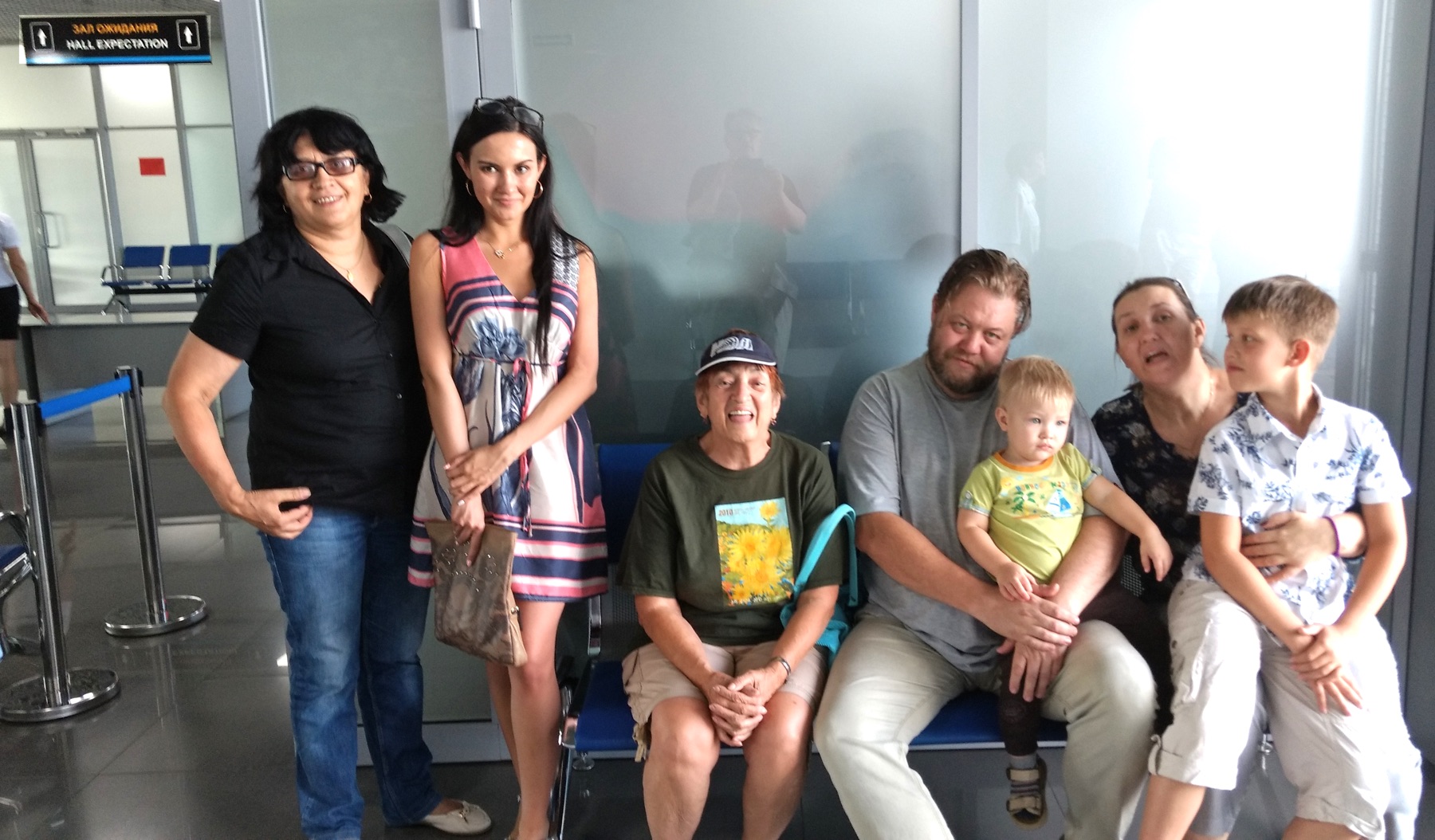 posed photo of friends in the airport