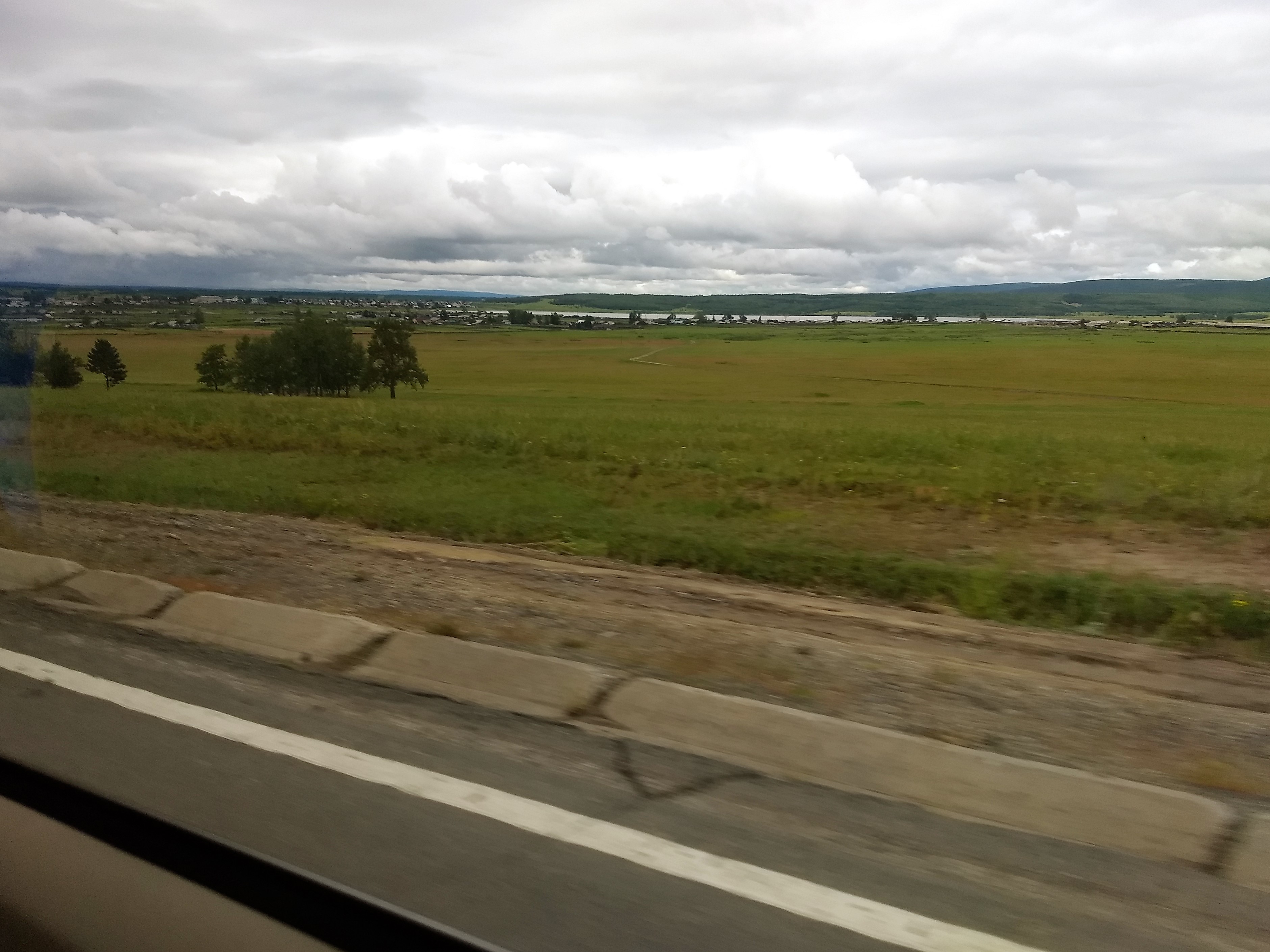 view outside car window of grassland